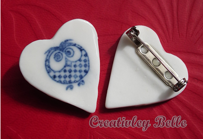 Blue and white porcelain owl pin front and back view